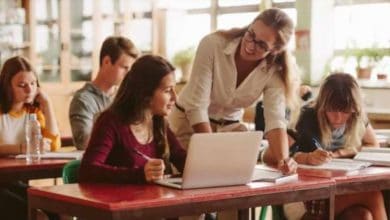 a teacher causing her students to learn